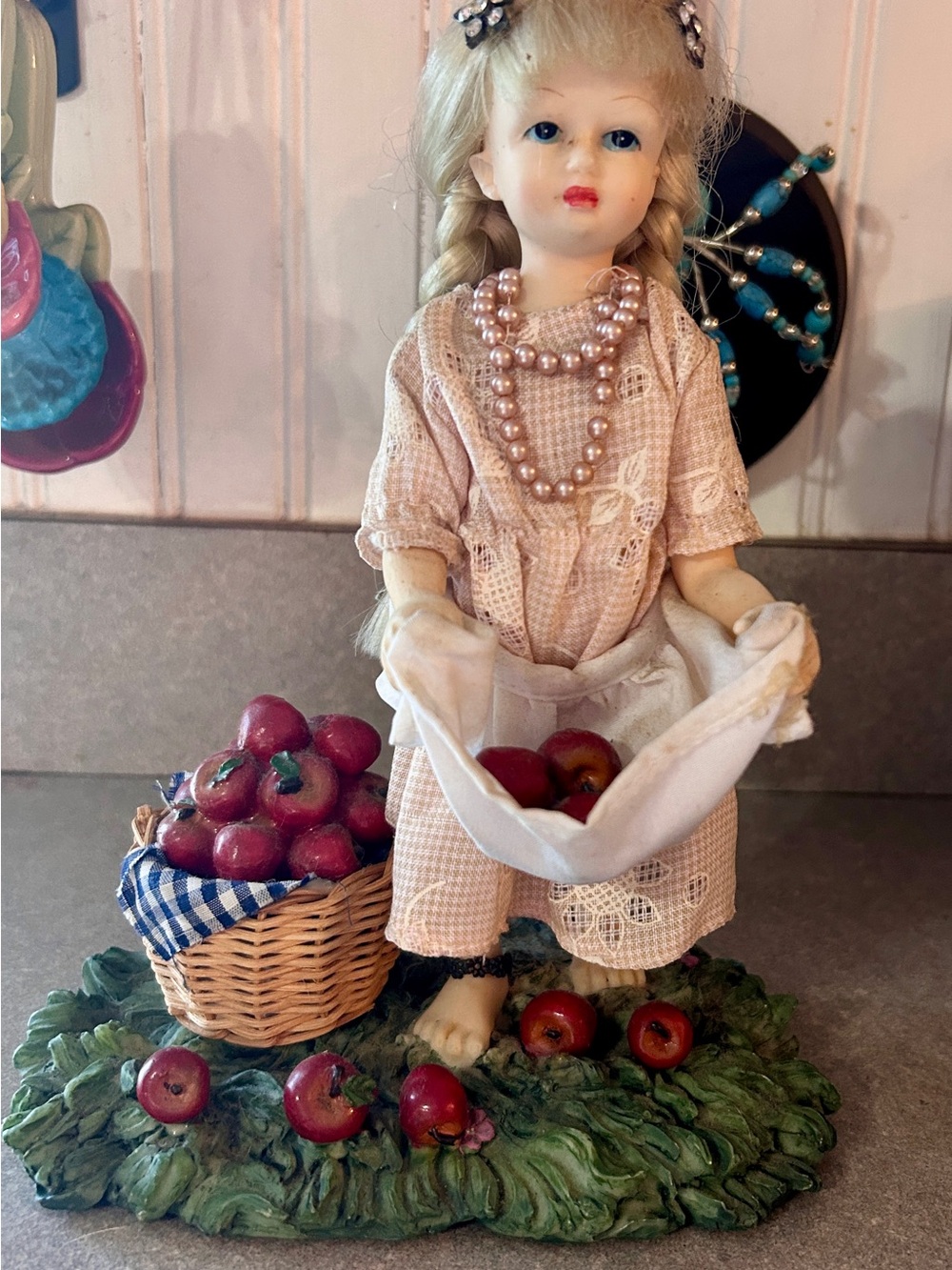 Vintage-Style Pink Porcelain Doll Figurine with Basket of Red Apples